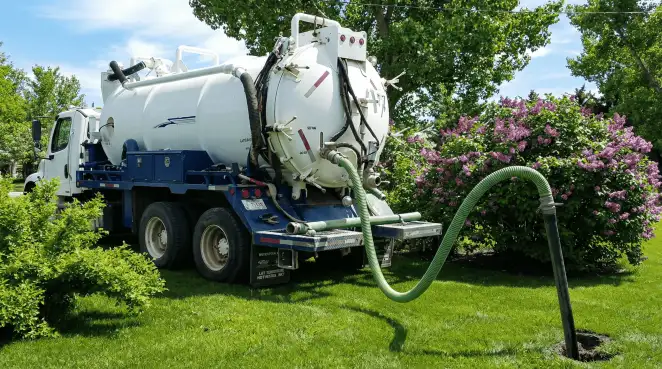 Professional vacuum truck performing residential drainage and septic maintenance in Baltimore, MD
